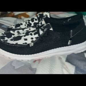 Hey Dude Black and White Cow Print Shoes